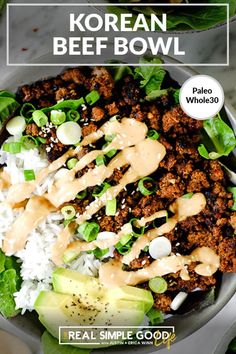 korean beef bowl with rice and avocado on the side, topped with dressing