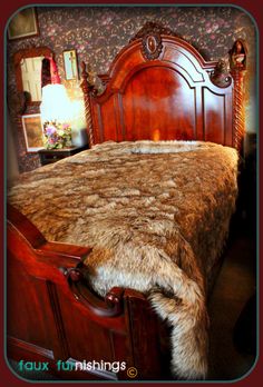 a bed with fur on top of it in a bedroom