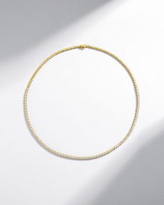 A stunning blend of elegance and modern sophistication, this tennis necklace features an exquisite row of princess-cut white diamonds. Each diamond catches the light from every angle, creating a radiant sparkle, perfect for both day and evening wear. Details 18k yellow gold, rose gold or white gold 3.25 carats of 1.5x1.5mm princess-cut white diamonds Necklace measures 17" inches in length Box clasp with safety lock fastening 3mm width Ref: BAP705D Elegant Gold Tennis Necklace With Baguette Diamonds, Gold Tennis Necklace With Baguette Diamonds, Gold Baguette Diamond Tennis Necklace Gift, Elegant Diamond Tennis Necklace With Pave Setting, Elegant Diamond White Tennis Necklace With Pave Setting, Luxury Yellow Gold Diamond Necklace With Sparkling Stones, Luxury Diamond Necklace With Sparkling Yellow Gold Stones, Luxury Diamond White Tennis Necklace With Pave Setting, Elegant Yellow Gold Tennis Necklace With Sparkling Stones