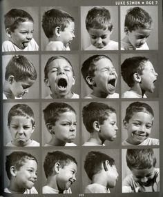 a black and white photo of young boys making faces