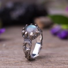 "Tree branch sculpted ring in sterling silver with labradorite gemstone. Witchy magical silver ring. This ring was sculpted in wax in the lost wax technique. Details & Measurement: * The ring width on the front side - 0.3\" (10 mm) * The ring width on the back side - 0.15\" (4 mm) * Gemstones in 8 mm to to set in the ring: Labradorite , rainbow moonstone, Smoky quarts in rose cut, Rutilated quartz with gold threads, Blue chalcedony in rose cut, Garnet * The ring arrives in a jewelry gift box Handmade Nature-inspired Moonstone Ring, Nature-inspired Moonstone Ring, Witch Ring, Sculpted Jewelry, Hand Carved Jewelry, Witch Rings, Mushroom Ring, Enchanted Jewelry, Twig Ring