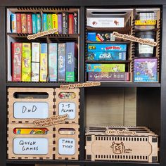 a book shelf filled with lots of books and wooden boxes on top of it's sides