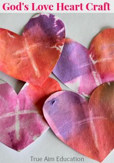 three hearts made out of colored paper with the words god's love heart craft