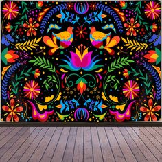 an image of a colorful wall mural with birds and flowers in the center on a wooden floor