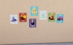 there are many cards on the wall with different animals in them, and one has a bear