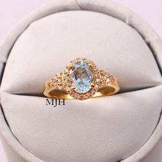 Oval Topaz Ring With Halo For Anniversary, Oval Halo Topaz Ring For Anniversary, Anniversary Oval Topaz Ring With Halo, Oval Aquamarine Promise Ring, Oval Aquamarine Wedding Ring, Oval Aquamarine Diamond Ring With Prong Setting, Oval Aquamarine Diamond Ring As Gift, Oval Aquamarine Birthstone Ring As Gift, Oval Aquamarine Crystal Wedding Ring