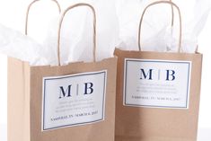 two brown paper bags with labels on them sitting next to each other in front of a white background