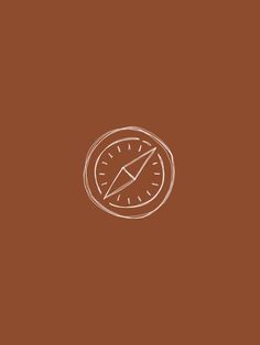 a brown background with a white compass on it