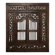 an old wooden window with carved designs on the front and side panels, isolated against a white background