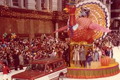 a parade float in front of a large crowd