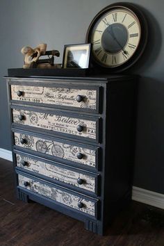 an old dresser with many drawers and a clock on top