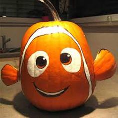 an orange stuffed animal sitting on top of a counter