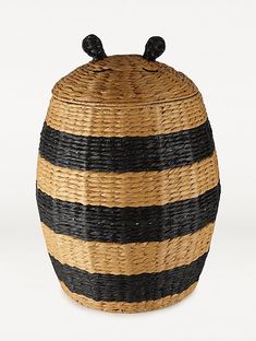 a black and yellow striped basket with ears on top