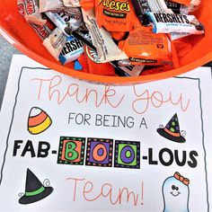 an orange bowl filled with candy and thank you for being a fab - booo - lous