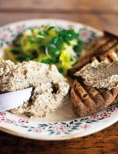 a close up of a plate of food with meat and bread on it, including broccoli