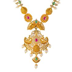 Virani Jewelers presents this opulent 22k gold necklace and earring set to adorn your neck and ears for special occasions. This beautiful 22k gold necklace and matching Chandbali earring set is tribute to Indian gold jewelry craftsmanship. This exquisite pairing of Indian gold jewelry features a symphony of gemstones, including emeralds and rubies, meticulously arranged to evoke timeless elegance. The warm embrace of 22k gold adds a regal touch, making this set a radiant celebration of tradition Bollywood Style Hand Set Yellow Gold Temple Necklace, Festive 22k Gold Bridal Necklace Hallmarked, Festive 22k Gold Hallmarked Bridal Necklace, Yellow Gold Temple Necklace With 17 Jewels For Diwali, Diwali Bridal Necklace In Yellow Gold With 17 Jewels, 22k Gold Temple Necklace With Gemstones, 22k Gold Gemstone Temple Necklace For Celebrations, 22k Gold Gemstone Temple Necklace For Ceremonial Occasions, Festive 22k Gold Hand Set Temple Necklace