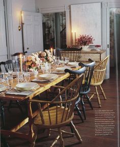 a dining room table is set with plates and glasses