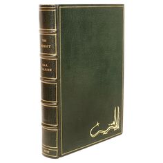 a green book with gold writing on it