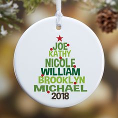 a personalized ornament hanging from a christmas tree