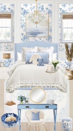 a bedroom decorated in blue and white with a teddy bear on it's bed