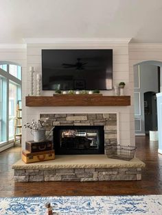 a fireplace with a flat screen tv above it