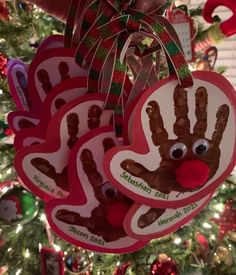 handprinted christmas ornament hanging from a tree