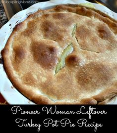 a pie sitting on top of a white plate next to a knife and fork in it