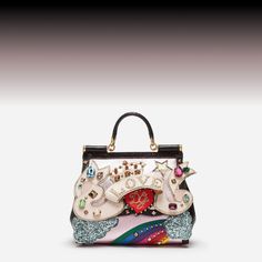 Looking for the perfect statement bag to elevate your style? Dolce & Gabbana's collection of high-end designer bags has something for everyone. Shop now at Sendegaro! With Love We Stride sendegaro.com #DolceGabbana #sendegaro #designerclothing #designerswear #dolcegabbanashoes #dolcegabbanabag #dolcegabbanadress #dolcegabbanawomen #dolcegabbanamen #dolcegabbanastyle #effortlessfashion Sicily Bag, Statement Bag, Heart Logo, Sheep Leather, Deer Skin