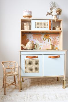 Ikea kitchen hack, play room inspo, floral wallpaper, floral decals, rattan decor, kids vanity, storage suitcases decor, girls bedroom decor, playroom decor, stylish playroom, girls playroom, styled play kitchen, Ikea play kitchen, removable decals, rattan webbing hack, kids playroom hacks Boho Playroom, Casa Clean