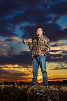 a man standing in the middle of a field