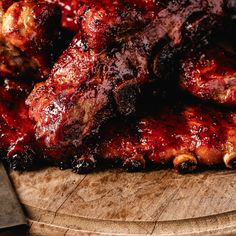 barbecue ribs with bbq sauce on a cutting board