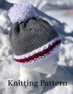 a knitted hat on top of a head in the snow