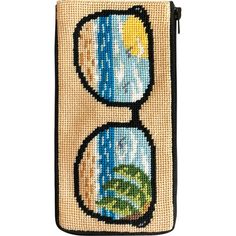 a cross stitched case with sunglasses on the front and side, featuring an image of a beach scene