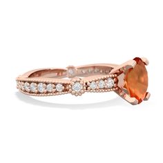 an orange stone ring with white diamonds on the sides and a rose cut diamond in the middle