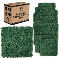 a box of grass wall next to it's cardboard package