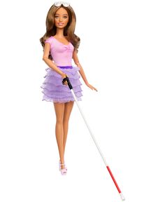 a barbie doll with a pink shirt and purple tutu skirt holding a white stick