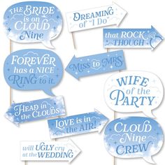 blue and white wedding photo booth props with clouds, stars and the words'love is in the air '