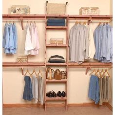 an organized closet with clothes, shoes and other items on shelves in the corner between two walls