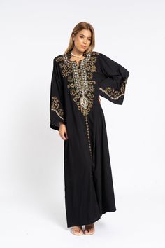 This stunning kaftan with its monotone embroidery will be your summer favorite. It is an extremely comfortable wear, light and soft and can be used on many occasions -  home gatherings, festival parties, summer occasions, dinners, or just in your home to feel comfortable.  Fabric : 70% Egyptian Cotton and 30% Polyester Sizes : The dress comes in two sizes. S/M/L which fits up to a size 14 US (Large) and one that fits up to a size 22 US (2XL). It comes with a cinch in the back to accentuate your Eid Maxi Dress With Intricate Embroidery, Black Long Kaftan With Dabka Work, Flowy Maxi Length Kaftan For Eid, Bohemian Embroidered Dress With Dabka Work, Bohemian Black Kaftan For Eid, Black Bohemian Kaftan For Eid, Traditional Flowy Maxi Length Kaftan, Flowy Maxi-length Abaya For Eid, Black Maxi Length Kaftan With Dabka