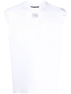 white cotton logo patch to the front round neck sleeveless When buying this unisex item, keep in mind that it is graded in standard men's sizing White Cotton Tops With Logo Patch, Summer Cotton Tops With Logo Patch, White Classic Crew Neck Tank Top, White Cotton Tank Top With Logo Print, Summer Cotton Tops With Logo Detail, White Sleeveless Top With Logo Print, Classic White Cotton Tank Top, White Cotton Muscle Tee For Streetwear, White Logo Print Tank Top For Streetwear