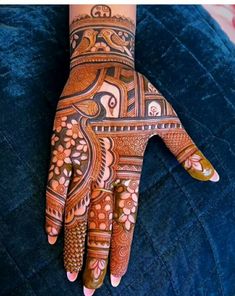 the hand is decorated with intricate designs