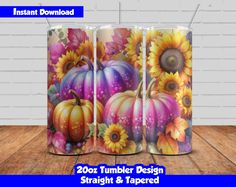 three colorful pumpkins and sunflowers on a wooden table with the text, instant download