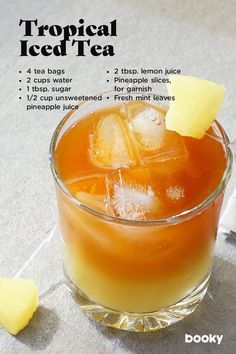 a cocktail with ice and pineapple garnish on the rim