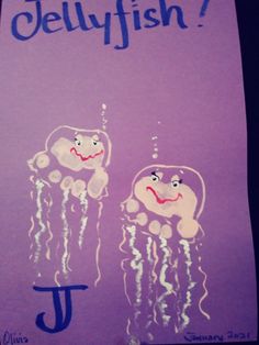 a purple poster with jellyfish drawn on it's side and the letter j