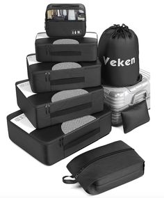 several pieces of luggage are stacked on top of each other with the words veken written on them