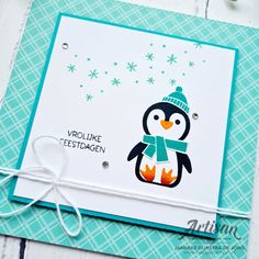 a card with a penguin wearing a hat and scarf