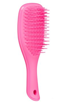 What it is: A detangling hairbrush in a travel size designed specifically for use in the shower, featuring a handle and no-slip design. What it does: This brush detangles without pulling, tugging or snagging hair. Its teeth glide effortlessly through all types of wet hair, making for an easy and painless experience. Plastic Made in the UK Good Hair Brushes, Mini Tangle Teezer, Girly Christmas Gifts, Makeup Bag Essentials, Hair Brushes, Preppy Room, Pink Girly Things