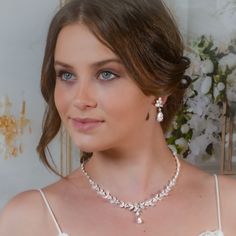 "Very romantic crystal bridal jewelry set: necklace, bracelet and earrings. Gorgeous bridal or bridesmaids jewelry set for your wedding day!   This wedding jewelry set is available in silver, gold or pink gold(rose gold) color to match your dress.   Necklace measures about 18\" long. Earrings measure about 1 1/4\" long and 1/4\" wide. Matching regular bracelet is measuring: 7\" long and 1/4\" wide or adjustable bracelet option is available as well to fit a larger wrist. Please, note that bracele Elegant Crystal Bridal Sets For Bride, Elegant Pearl Drop Bridal Set For Wedding, Delicate Cubic Zirconia Jewelry For Mother Of The Bride, Elegant White Jewelry Sets For Brides, Elegant White Bridal Set, Wedding Crystal Jewelry Sets With Pearl Drop, Wedding Crystal Pearl Drop Jewelry Sets, Elegant Crystal Bridal Necklace, Crystal Pearl Drop Jewelry Sets For Wedding