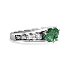 a ring with a green stone and white diamonds on the side, set in 18k white gold