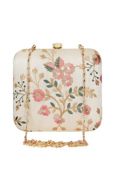 This beige and multicolored floral embroidered hand-crafted faux silk square box clutch is perfect for party or formal look. It has one main compartment with clasp closure and a detachable metal chain. Can also be used as a sling bag. Product Features: Color: Beige and Multi-color Material: Faux Silk Length: 7 Inches Size(L x B x H) : 16 x 4 x 16 cm Product Type: Clutch Occasion: Party, Formal Fabric Care: Wipe with a clean, dry cloth to remove dust Product Weight: 310 Grams Disclaimer: Color Wedding Evening Party, Boho Clutch, Silk Clutch, Wrist Bag, Embroidered Clutch, Party Clutch, Box Clutch, Cream Silk, Ladies Clutch